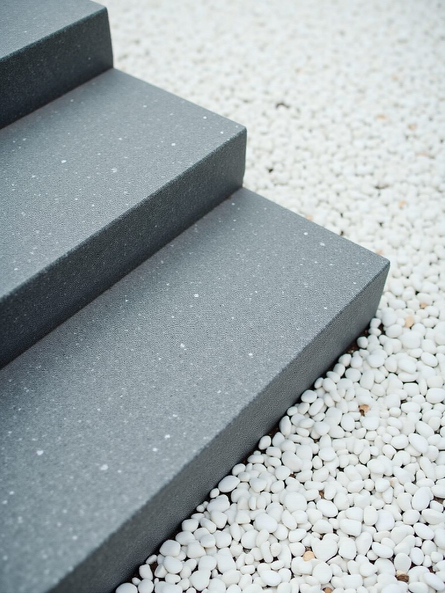 Dark granite steps with white pebble surround